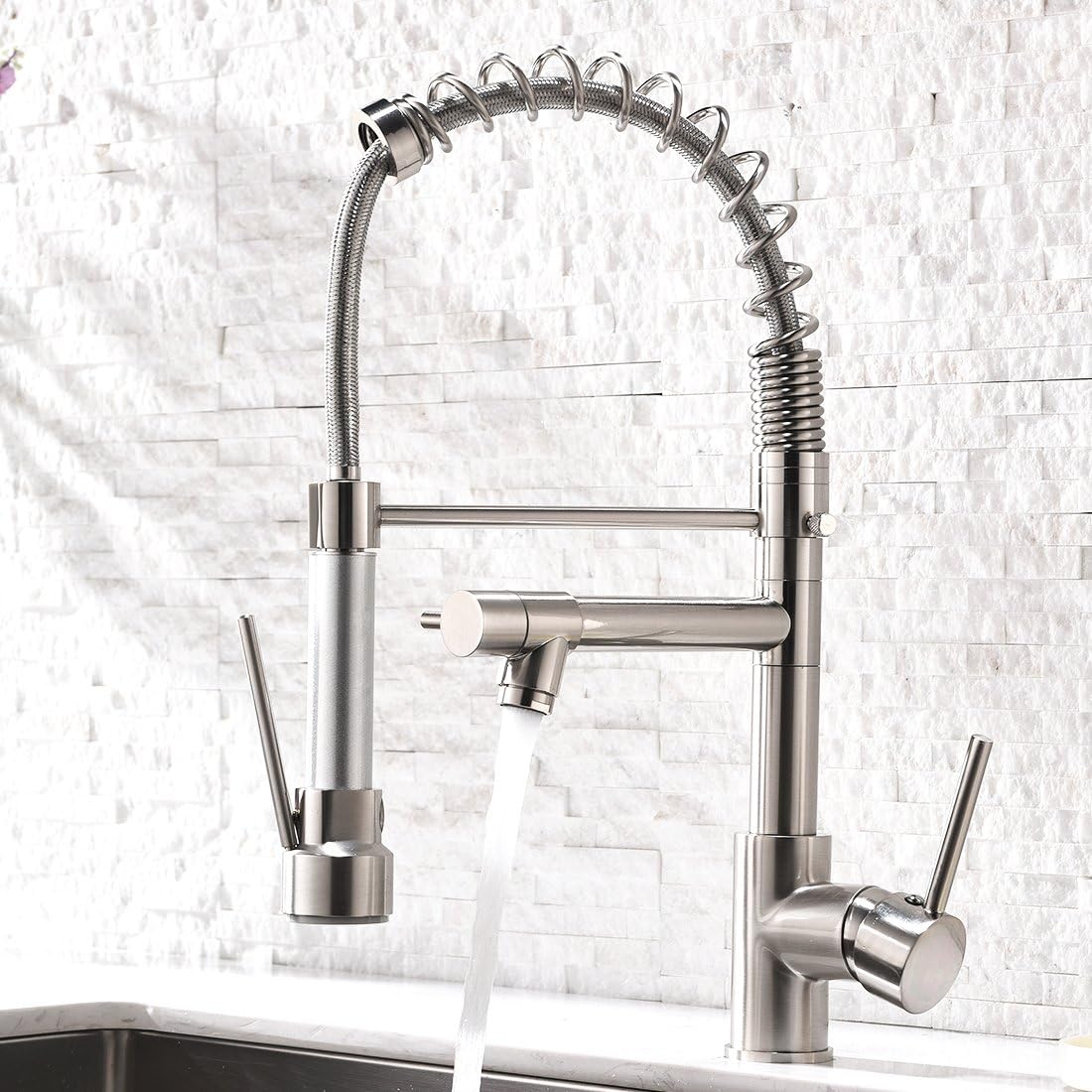 I am extremely pleased with this purchase! Very heavy duty and well made! The water pressure is unbelievable and the fact that you have two different water sprayers makes this very unique. Everyone that has seen my new kitchen raves about this faucet! Highly recommend this one!!! I got the black with silver and it looks very sharp with my black sink!