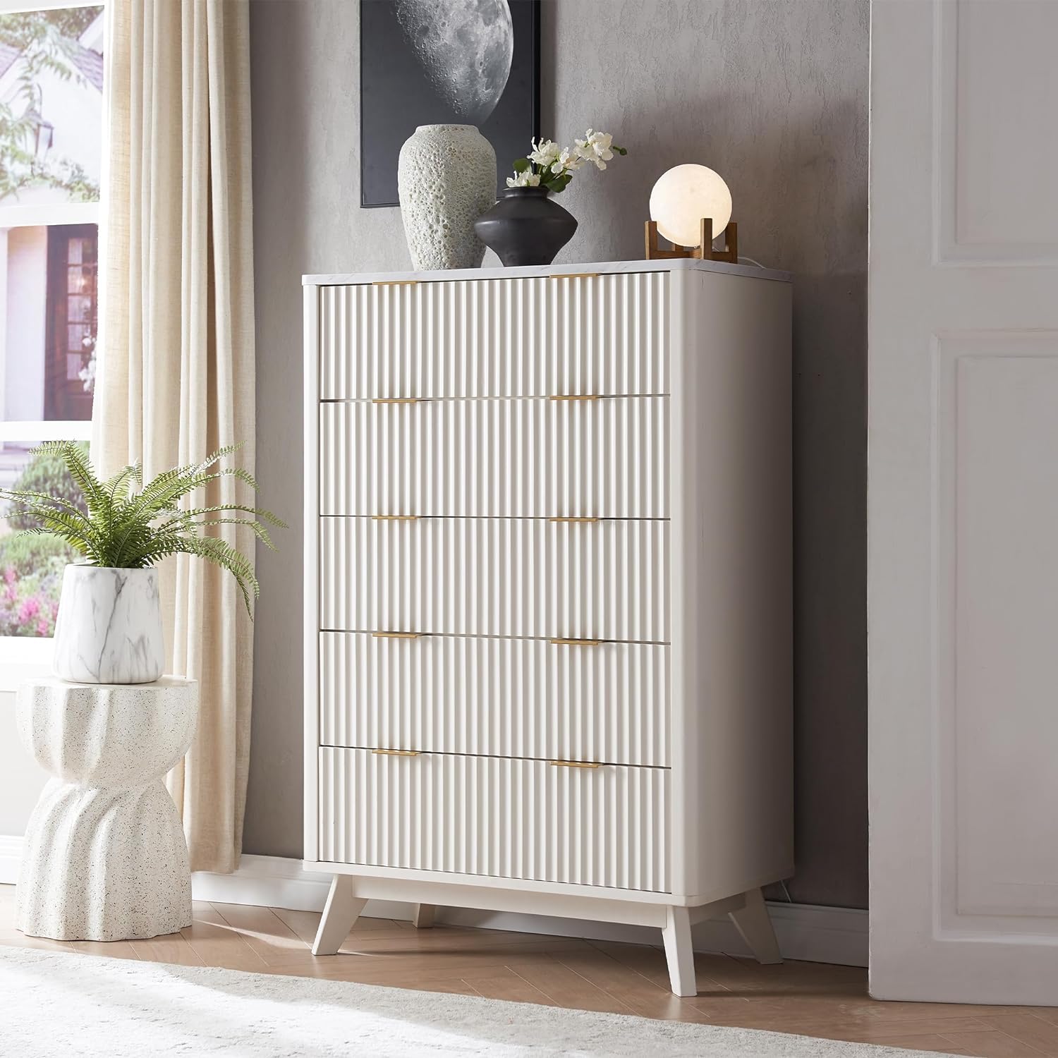 this dresser is very sturdy, the images make it appear white but its more of an off white/eggshell color but its still very pretty. i love the gold details & the textured front part. the top of the dresser has a marble affect. the inside of the drawers arent that big in width but the length & depth of the drawers make up for it. assembling it didnt take that long, i saw a lot of reviews saying it took them 4/5 hours but my brother & his friend built it in 2 hours, they said the instructions 